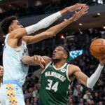 Milwaukee Bucks forward Giannis Antetokounmpo (34) looks to shoot under pressure from San Antonio Spurs forward Victor Wembanyama (1) during the fourth quarter at Fiserv Forum