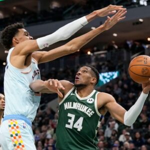 Milwaukee Bucks forward Giannis Antetokounmpo (34) looks to shoot under pressure from San Antonio Spurs forward Victor Wembanyama (1) during the fourth quarter at Fiserv Forum