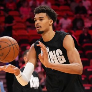 San Antonio Spurs center Victor Wembanyama (1) warms up before the game against the Miami Heat at Kaseya Center