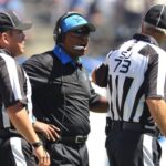 San Diego, CA, USA; Detroit Lions head coach Jim Caldwell (center) talks to side judge Joe Larrew (73) and head linesman Hugo Cruz (94) during the first quarter of the game against the San Diego Chargers at Qualcomm Stadium. San Diego won 33-28.