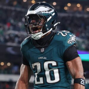 Jan 26, 2025; Philadelphia, PA, USA; Philadelphia Eagles running back Saquon Barkley (26) celebrates after a touchdown against the Washington Commanders during the second half in the NFC Championship game at Lincoln Financial Field.