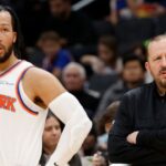 New York Knicks head coach Tom Thibodeau (R) and Knicks guard Jalen Brunson (11) look on during a stoppage in play against the Washington Wizards in the third quarterat Capital One Arena.