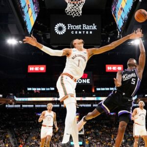 Sacramento Kings guard De'Aaron Fox (5) shoots over San Antonio Spurs forward Victor Wembanyama (1) during the second half at Frost Bank Center.