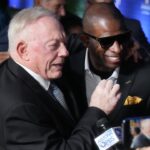 Cowboys owner Jerry Jones and former NFL cornerback Deion Sanders embrace as they walk the red carpet before the NFL Honors awards special at the Phoenix Convention Center on Thursday, Feb. 9, 2023