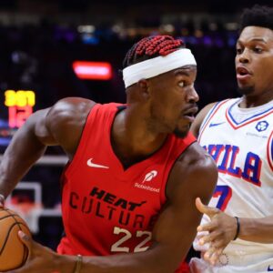 Miami Heat forward Jimmy Butler (22) protects the basketball from Philadelphia 76ers guard Kyle Lowry (7) during the second quarter at Kaseya Center