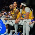 Los Angeles Lakers forward Anthony Davis (3) and Los Angeles Lakers forward LeBron James (23) during a timeout against the Charlotte Hornets during the first quarter at the Spectrum Center