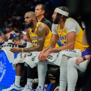 Los Angeles Lakers forward Anthony Davis (3) and Los Angeles Lakers forward LeBron James (23) during a timeout against the Charlotte Hornets during the first quarter at the Spectrum Center