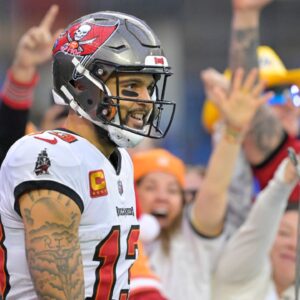Fans celebrate after a touchdown by Tampa Bay Buccaneers wide receiver Mike Evans (13) in the second half against the Los Angeles Chargers at SoFi Stadium.