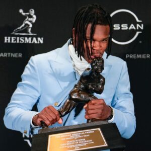 Colorado Buffaloes wide receiver/cornerback Travis Hunter poses for a photo after winning the Heisman Trophy award during the 2024 Heisman Trophy Presentation.