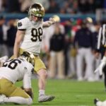 Jan 9, 2025; Miami, FL, USA; Notre Dame Fighting Irish place kicker Mitch Jeter (98) kicks the ball in the second half against the Penn State Nittany Lions at Hard Rock Stadium.