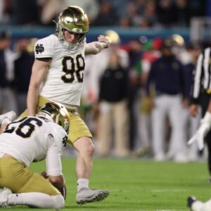 Jan 9, 2025; Miami, FL, USA; Notre Dame Fighting Irish place kicker Mitch Jeter (98) kicks the ball in the second half against the Penn State Nittany Lions at Hard Rock Stadium.