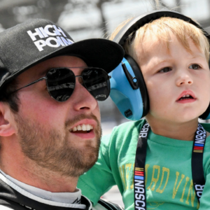 NASCAR Cup Series driver Chase Briscoe (14) holds his son, Brooks, during qualifying for the Brickyard 400, Saturday, July 20, 2024, at Indianapolis Motor Speedway.