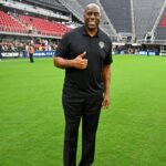 Washington Commanders owner Magic Johnson poses for a photo after the game between the Washington Spirit and Portland Thorns FC at Audi Field.