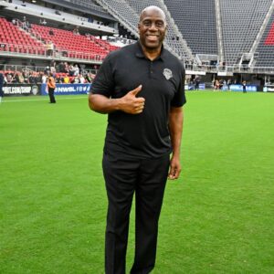 Washington Commanders owner Magic Johnson poses for a photo after the game between the Washington Spirit and Portland Thorns FC at Audi Field.
