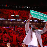 Former Miami Heat guard Dwyane Wade is honored with 'Dwayne Wade Blvd' at halftime during a game against the Detroit Pistons at Kaseya Center.