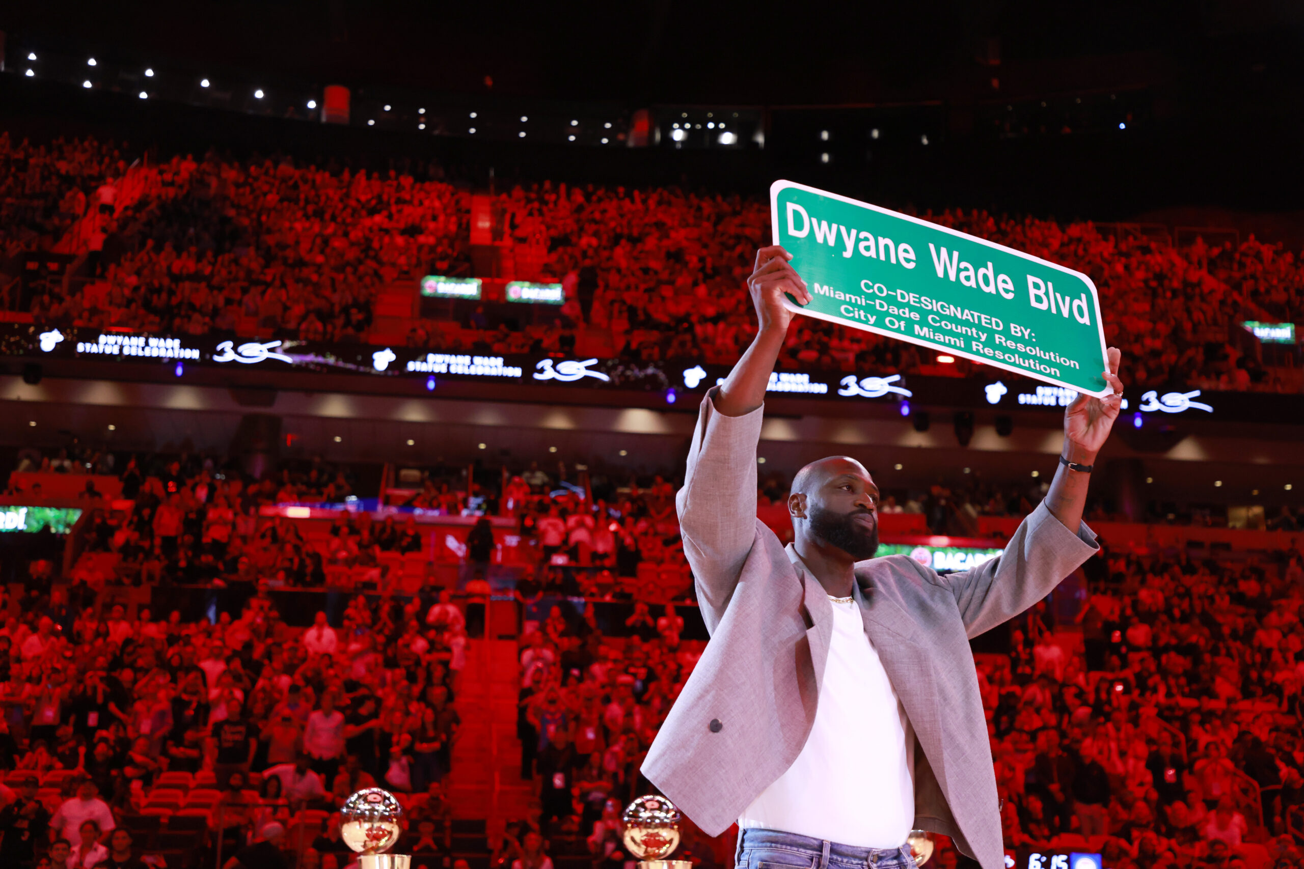 Former Miami Heat guard Dwyane Wade is honored with 'Dwayne Wade Blvd' at halftime during a game against the Detroit Pistons at Kaseya Center.