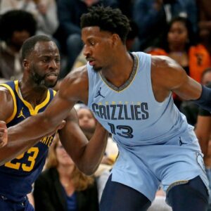 Memphis Grizzlies forward-center Jaren Jackson Jr. (13) dribbles as Golden State Warriors forward Draymond Green (23) defends during the second half at FedExForum.