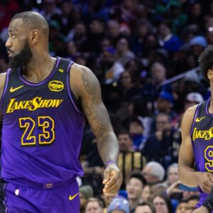 Los Angeles Lakers forward LeBron James (23) and guard Bronny James (9) look on during the third quarter against the Philadelphia 76ers at Wells Fargo Center.