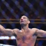 Sean Strickland (red gloves)celebrates defeating Paulo Costa (blue gloves) during UFC 302 at Prudential Center.