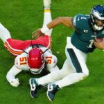 Eagles quarterback Jalen Hurts scrambles for extra yardage during the first half of Super Bowl 57 against the Chiefs on Feb. 12, 2023.