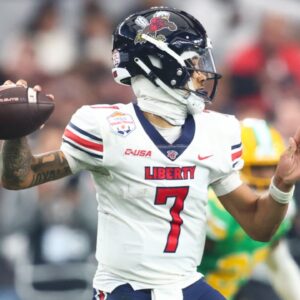 Jan 1, 2024; Glendale, AZ, USA; Liberty Flames quarterback Kaidon Salter (7) throws against the Oregon Ducks during the second half in the 2024 Fiesta Bowl at State Farm Stadium.