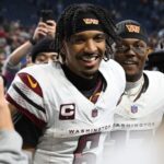Jan 18, 2025; Detroit, Michigan, USA; Washington Commanders quarterback Jayden Daniels (5) and wide receiver Terry McLaurin (17) celebrate the win against Detroit Lions in a 2025 NFC divisional round game at Ford Field.