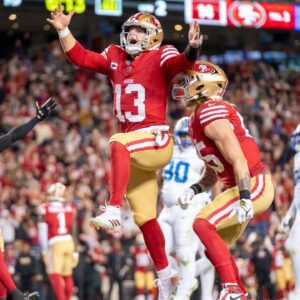 California, USA; San Francisco 49ers quarterback Brock Purdy (13) celebrates with tight end George Kittle (85) after scoring a touchdown against the Detroit Lions during the second quarter at Levi's Stadium.