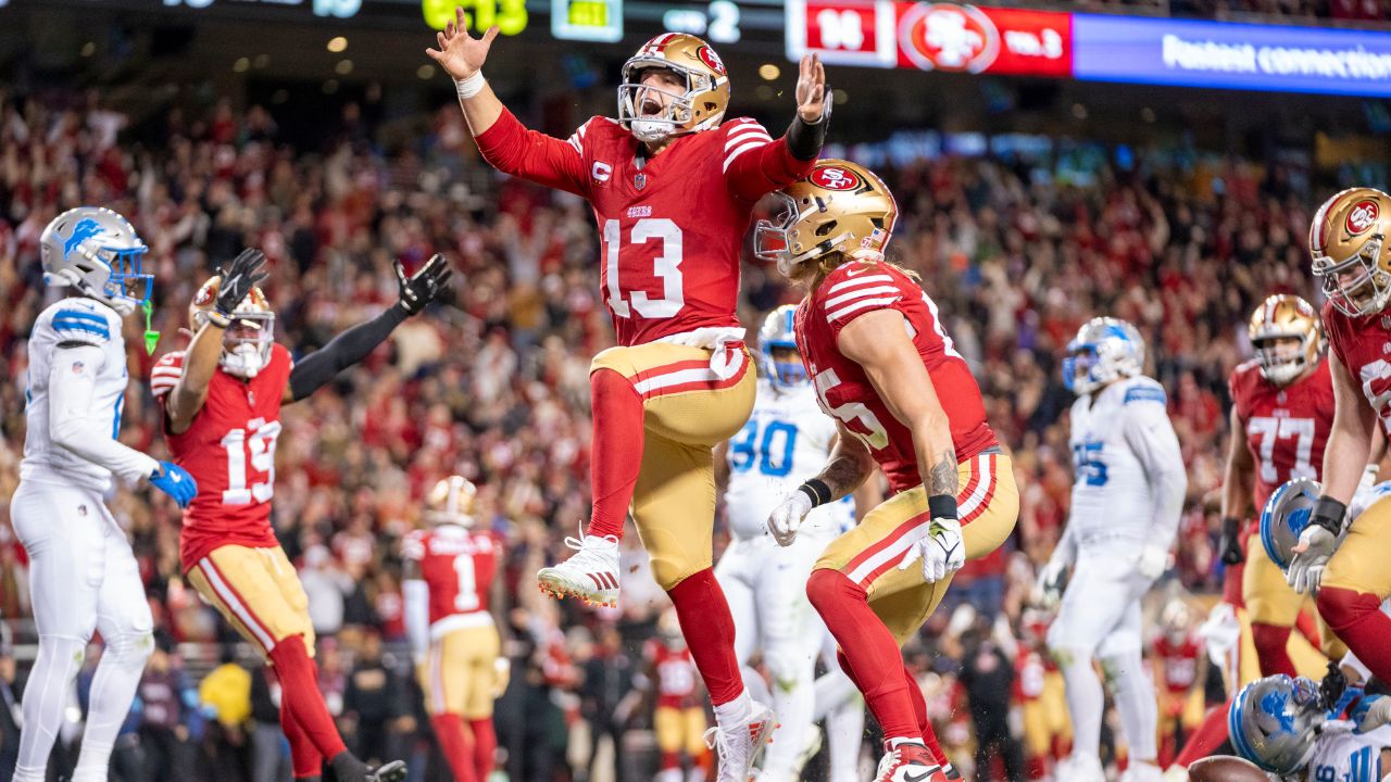 California, USA; San Francisco 49ers quarterback Brock Purdy (13) celebrates with tight end George Kittle (85) after scoring a touchdown against the Detroit Lions during the second quarter at Levi's Stadium.