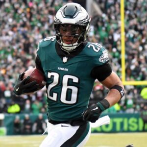 Jan 26, 2025; Philadelphia, PA, USA; Philadelphia Eagles running back Saquon Barkley (26) runs with the ball for a touchdown against the Washington Commanders during the first half in the NFC Championship game at Lincoln Financial Field.