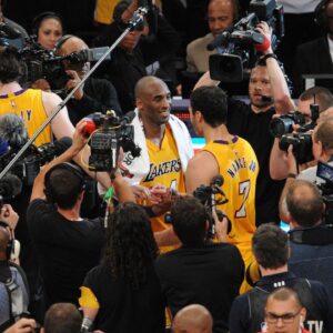 Los Angeles Lakers forward Kobe Bryant (24) meets with forward Larry Nance Jr. (7) following the 101-96 victory against Utah Jazz at Staples Center.