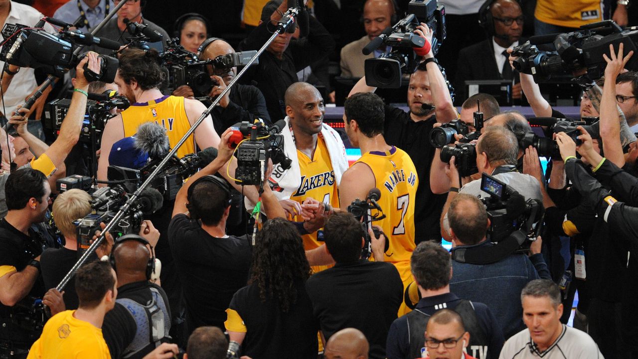 Los Angeles Lakers forward Kobe Bryant (24) meets with forward Larry Nance Jr. (7) following the 101-96 victory against Utah Jazz at Staples Center.