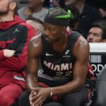 Miami Heat forward Jimmy Butler (22) looks on from the bench during the second half at Kaseya Center.