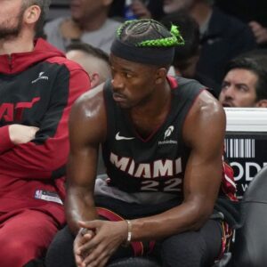 Miami Heat forward Jimmy Butler (22) looks on from the bench during the second half at Kaseya Center.