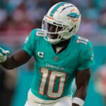 Dec 22, 2024; Miami Gardens, Florida, USA; Miami Dolphins wide receiver Tyreek Hill (10) signals from the line of scrimmage against the San Francisco 49ers during the second quarter at Hard Rock Stadium.