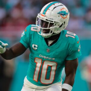Dec 22, 2024; Miami Gardens, Florida, USA; Miami Dolphins wide receiver Tyreek Hill (10) signals from the line of scrimmage against the San Francisco 49ers during the second quarter at Hard Rock Stadium.