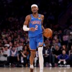 Oklahoma City Thunder guard Shai Gilgeous-Alexander (2) brings the ball up court against the New York Knicks during the first quarter at Madison Square Garden
