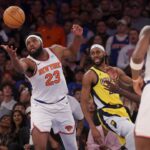 New York Knicks center Mitchell Robinson (23) grabs a rebound against Indiana Pacers forward Isaiah Jackson (22) during the fourth quarter of game one of the second round of the 2024 NBA playoffs at Madison Square Garden.