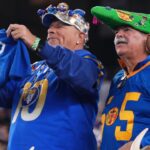 Jan 13, 2025; Glendale, AZ, USA; Los Angeles Rams fans react against the Minnesota Vikings during the first half in an NFC wild card game at State Farm Stadium.