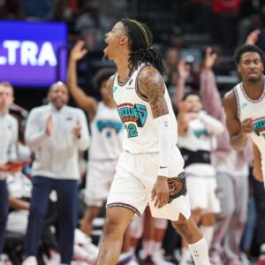 Memphis Grizzlies guard Ja Morant (12) reacts after scoring during the second half against the Houston Rockets at Toyota Center