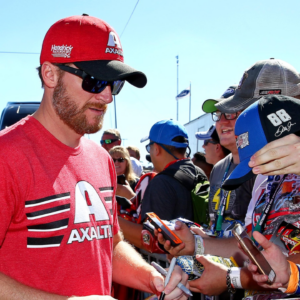 NASCAR Cup Series driver Dale Earnhardt Jr. (88) signs autographs before the Ford EcoBoost 400 at Homestead-Miami Speedway.