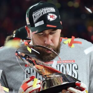 Jan 26, 2025; Kansas City, MO, USA; Kansas City Chiefs tight end Travis Kelce (87) reacts on stage after the AFC Championship game against the Buffalo Bills at GEHA Field at Arrowhead Stadium.