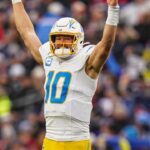 Dec 28, 2024; Foxborough, Massachusetts, USA; Los Angeles Chargers quarterback Justin Herbert (10) reacts after his touchdown pass against the New England Patriots in the third quarter at Gillette Stadium.