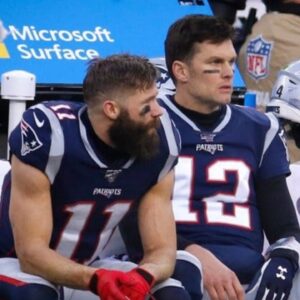Patriots receiver Julian Edelman, quarterback Tom Brady and offensive coordinator Josh McDaniels can only watch from the bench as the Dolphins drive down the field in the final minutes of Sunday's game. The 27-24 loss meant the Patriots missed out on the No. 2 seed in the AFC playoffs and a first-round bye.