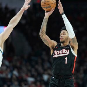 Portland Trail Blazers shooting guard Anfernee Simons (1) shoots the ball over Milwaukee Bucks shooting guard Pat Connaughton (24) during the first half at Moda Center.