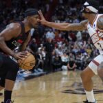 Miami Heat forward Jimmy Butler (22) is guarded by Phoenix Suns guard Bradley Beal (3) during the fourth quarter at Kaseya Center