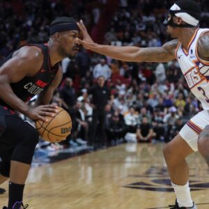 Miami Heat forward Jimmy Butler (22) is guarded by Phoenix Suns guard Bradley Beal (3) during the fourth quarter at Kaseya Center