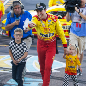 NASCAR Cup Series driver Joey Logano (22) celebrates with his children after winning the 2024 NASCAR Cup Series championship and the NASCAR Cup Series Championship race at Phoenix Raceway.