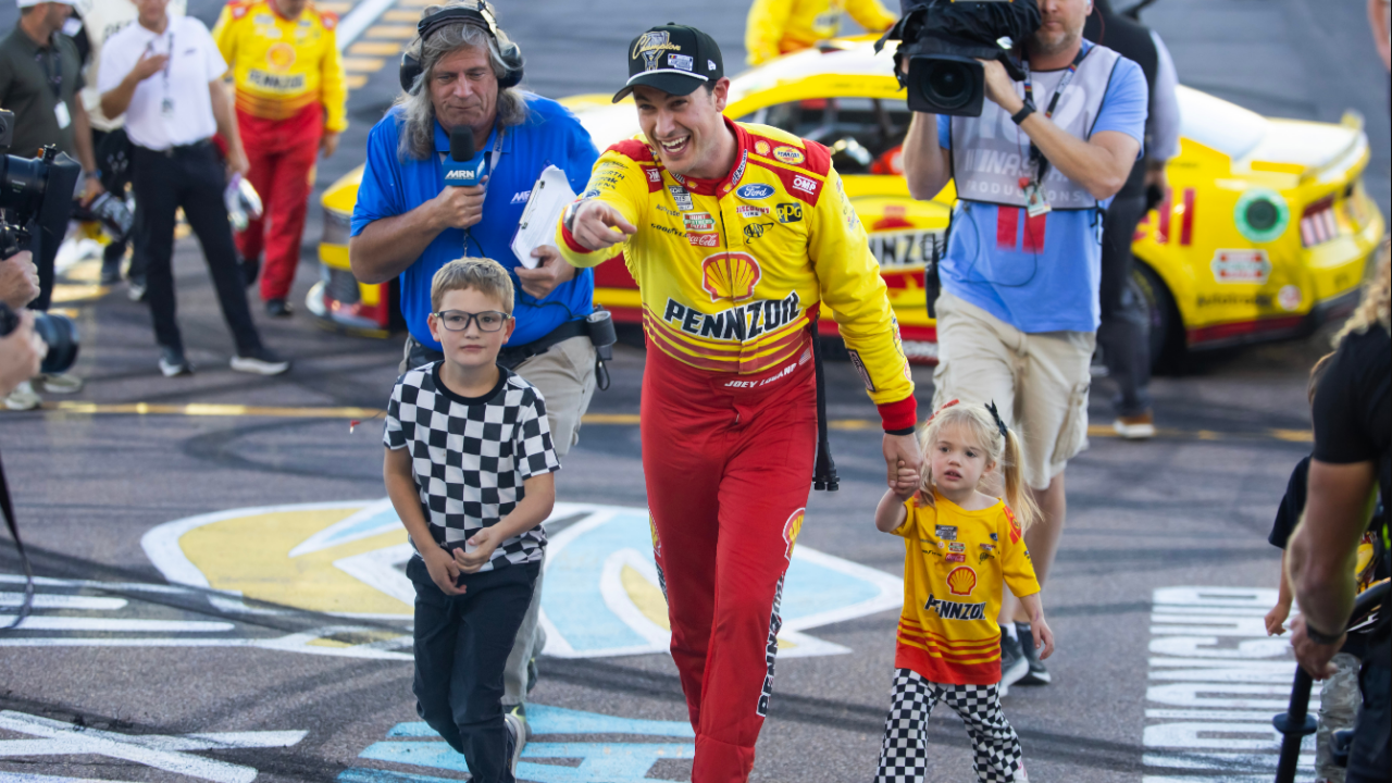 NASCAR Cup Series driver Joey Logano (22) celebrates with his children after winning the 2024 NASCAR Cup Series championship and the NASCAR Cup Series Championship race at Phoenix Raceway.