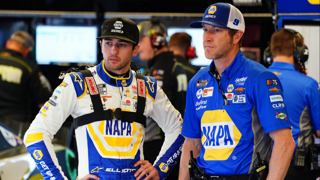 NASCAR Cup Series driver Chase Elliott (9) talks with his crew chief Alan Gustafson as they work to ready his car before practice for the Daytona 500 at Daytona International Speedway.