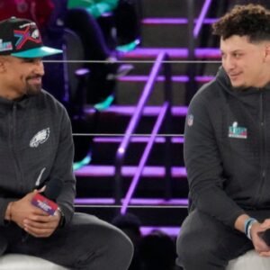 Philadelphia Eagles quarterback Jalen Hurts and Kansas City Chiefs quarterback Patrick Mahomes chat on stage at the Footprint Center in downtown Phoenix during the NFL's Super Bowl Opening Night on Feb. 6, 2023. Nfl Super Bowl Opening Night At Footprint Center